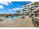Inviting outdoor pool area with lounge chairs and an outdoor grill, perfect for relaxation and entertainment at 945 E Playa Del Norte Dr # 5005, Tempe, AZ 85288