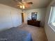 Bright bedroom showcasing a functional layout, dresser, carpet, and a serene atmosphere at 10013 W Alabama Ave, Sun City, AZ 85351