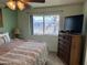 Bedroom featuring a window offering natural light and a view at 10013 W Alabama Ave, Sun City, AZ 85351