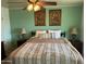 Comfortable bedroom with traditional decor and overhead fan at 10013 W Alabama Ave, Sun City, AZ 85351