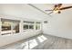 Bright bonus room with ceiling fan and lots of windows at 10025 W Alabama Ave, Sun City, AZ 85351