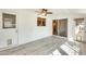 Bonus room featuring a ceiling fan, lots of windows, and access to the outdoors at 10025 W Alabama Ave, Sun City, AZ 85351