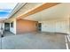 Spacious covered carport showcasing ample parking space and convenient access to the house at 10025 W Alabama Ave, Sun City, AZ 85351