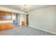 Bright dining area featuring modern floors, wood cabinets, and ample space at 10025 W Alabama Ave, Sun City, AZ 85351