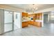 Open dining room with wood cabinets, modern flooring, and large sliding doors at 10025 W Alabama Ave, Sun City, AZ 85351