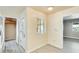 Hallway with a window, and doorways leading to other rooms at 10025 W Alabama Ave, Sun City, AZ 85351