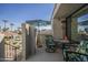 Relaxing balcony with views of the community pool, water features, and lush landscaping at 10115 E Mountain View Rd # 2042, Scottsdale, AZ 85258