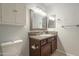 Updated bathroom featuring dark wood vanity with granite countertop and brushed nickel hardware at 10115 E Mountain View Rd # 2042, Scottsdale, AZ 85258