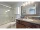 Updated bathroom features a shower over tub, dark wood vanity, and grey mosaic backsplash at 10115 E Mountain View Rd # 2042, Scottsdale, AZ 85258