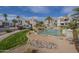 A community exterior view showcasing lush landscaping and a fountain at 10115 E Mountain View Rd # 2042, Scottsdale, AZ 85258