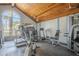 Community gym with vaulted ceiling, arched window, and various machines and weights at 10115 E Mountain View Rd # 2042, Scottsdale, AZ 85258