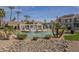 Stunning community pool area with lush landscaping, fountains, and comfortable lounge chairs at 10115 E Mountain View Rd # 2042, Scottsdale, AZ 85258