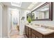 Bright bathroom with a skylight, granite countertops, and a tiled shower at 10127 E Minnesota Ave, Sun Lakes, AZ 85248