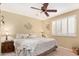 Bedroom featuring plantation shutters, neutral color palette, and carpet at 10127 E Minnesota Ave, Sun Lakes, AZ 85248