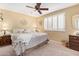 Bedroom featuring plantation shutters, neutral color palette, and carpet at 10127 E Minnesota Ave, Sun Lakes, AZ 85248