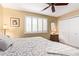 Bedroom featuring plantation shutters, neutral color palette, and carpet at 10127 E Minnesota Ave, Sun Lakes, AZ 85248