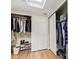 Walk-in closet with ample storage and organization, including shelves and hanging rods at 10127 E Minnesota Ave, Sun Lakes, AZ 85248