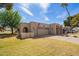 Charming home with a two-car garage, American flag, and desert landscaping at 10127 E Minnesota Ave, Sun Lakes, AZ 85248