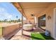 Relaxing covered patio with comfortable seating, brick flooring, and views of the lush golf course at 10127 E Minnesota Ave, Sun Lakes, AZ 85248