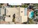 Aerial view showcasing the home's layout, tile roof, pool, and well-maintained surroundings at 10337 E Michigan Ave, Sun Lakes, AZ 85248