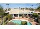 Aerial view showcasing the private pool, brick patio, and lush greenery surrounding the property at 10337 E Michigan Ave, Sun Lakes, AZ 85248