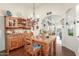 Inviting dining room showcases a wooden table, hardwood floors, a chandelier, and a lovely built-in hutch at 10337 E Michigan Ave, Sun Lakes, AZ 85248