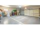 Spacious two-car garage offering ample storage space and a well-maintained floor with marked parking guides at 10337 E Michigan Ave, Sun Lakes, AZ 85248