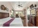 Bright main bedroom featuring hardwood floors, vaulted ceilings, and a sitting area at 10337 E Michigan Ave, Sun Lakes, AZ 85248