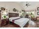 Inviting main bedroom featuring hardwood floors, vaulted ceilings, and a sitting area at 10337 E Michigan Ave, Sun Lakes, AZ 85248