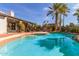 Refreshing pool with brick trim, lush landscaping, and inviting design for outdoor relaxation and enjoyment at 10337 E Michigan Ave, Sun Lakes, AZ 85248