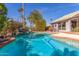 Beautiful pool and backyard area with desert landscaping and clear blue skies at 10337 E Michigan Ave, Sun Lakes, AZ 85248