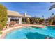 Relaxing pool surrounded by lush landscaping and mature trees creating a tranquil oasis at 10337 E Michigan Ave, Sun Lakes, AZ 85248