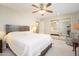 This bedroom has carpet floors, a ceiling fan and mirrored closets at 10511 W Edgewood Dr, Sun City, AZ 85351