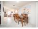 Inviting dining room features a large table with seating for six, adjacent to the living area at 10511 W Edgewood Dr, Sun City, AZ 85351