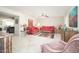 Bright living room with neutral tile flooring and an open concept floorplan at 10511 W Edgewood Dr, Sun City, AZ 85351