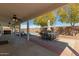 Inviting covered patio area perfect for outdoor dining and relaxing by the sparkling pool at 10616 E Carol Ave, Mesa, AZ 85208