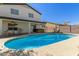 Inviting pool area and backyard with a covered patio and lush landscaping for outdoor relaxation and enjoyment at 10616 E Carol Ave, Mesa, AZ 85208