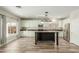 Modern kitchen featuring white cabinets, stainless steel appliances, granite countertops and a center island at 10616 E Carol Ave, Mesa, AZ 85208