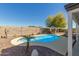 Cozy backyard pool surrounded by desert landscaping, creating a relaxing and private outdoor retreat at 10616 E Carol Ave, Mesa, AZ 85208