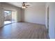 Bedroom with tile flooring, ceiling fan and a sliding glass door to the patio at 11011 N Zephyr Dr # 106, Fountain Hills, AZ 85268