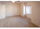 Bedroom with wood look tile floor, ceiling fan, neutral paint and natural light at 11011 N Zephyr Dr # 106, Fountain Hills, AZ 85268