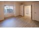 Bright bedroom featuring wood look tile floors, large windows, and neutral walls at 11011 N Zephyr Dr # 106, Fountain Hills, AZ 85268