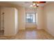 Bedroom with neutral walls, tile flooring, and a view of the neighborhood at 11011 N Zephyr Dr # 106, Fountain Hills, AZ 85268