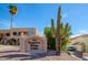 Desert landscaping highlights the Saguaro Ridge Villas sign on a bright sunny day at 11011 N Zephyr Dr # 106, Fountain Hills, AZ 85268