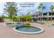 Community fountain surrounded by brick walkways, mature trees, and a park at 11011 N Zephyr Dr # 106, Fountain Hills, AZ 85268