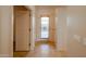 Bright hallway featuring a back door with window and tiled flooring at 11011 N Zephyr Dr # 106, Fountain Hills, AZ 85268