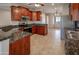 Spacious kitchen featuring cherry wood cabinets, and stainless steel appliances at 11011 N Zephyr Dr # 106, Fountain Hills, AZ 85268