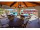 Poolside lounge with wooden-beam ceiling and comfortable seating overlooking a pool and spa at 11011 N Zephyr Dr # 106, Fountain Hills, AZ 85268