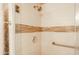 Custom shower with decorative tile border and rainfall showerhead at 11011 N Zephyr Dr # 106, Fountain Hills, AZ 85268