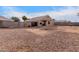 Expansive backyard featuring gravel ground cover, block fence, and a covered patio area at 11178 W Echo Ln, Peoria, AZ 85345